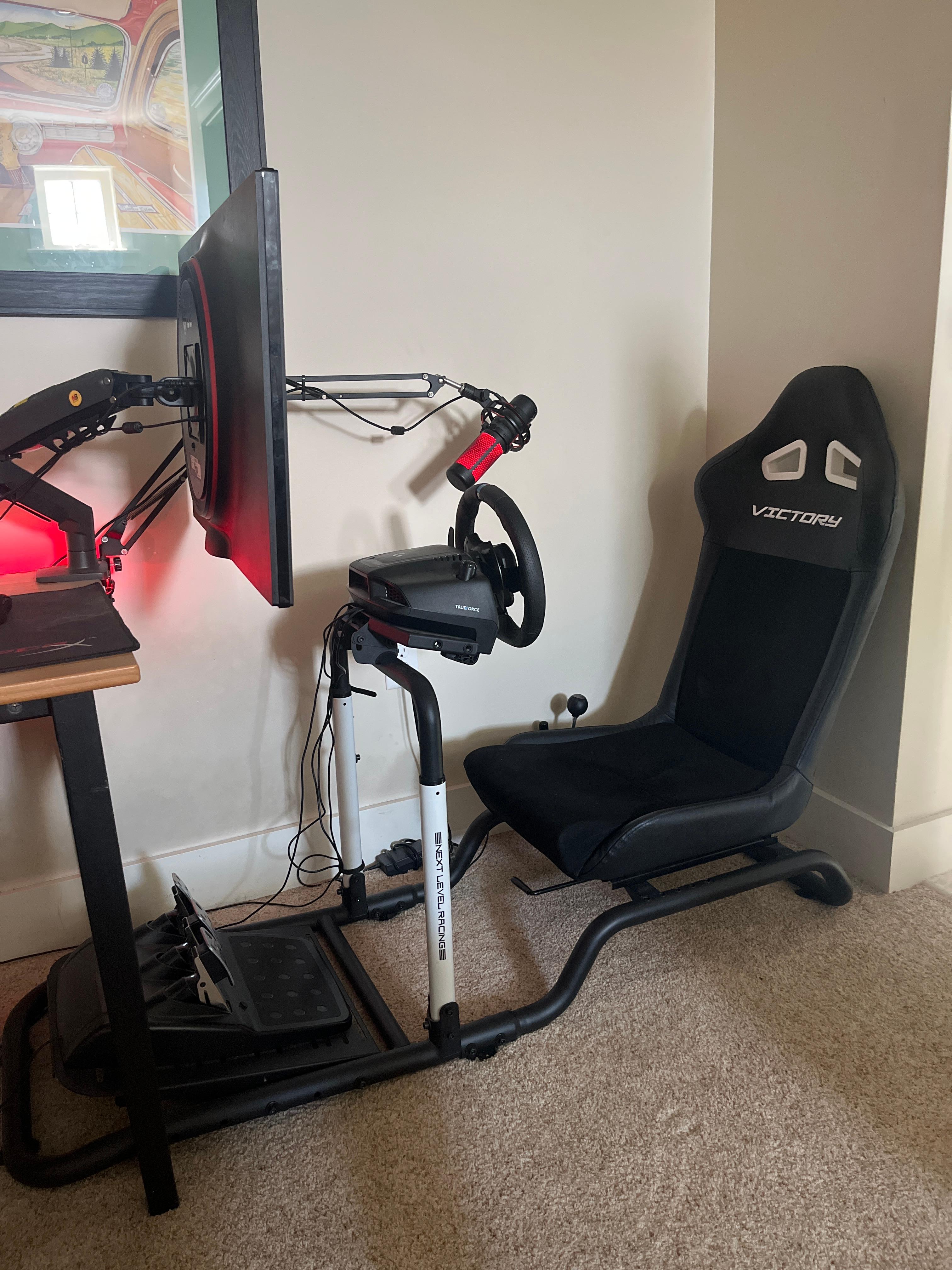 i have next level racing victory cockpit and monitor arm that can swivel so i can play normal pc games on same monitor
